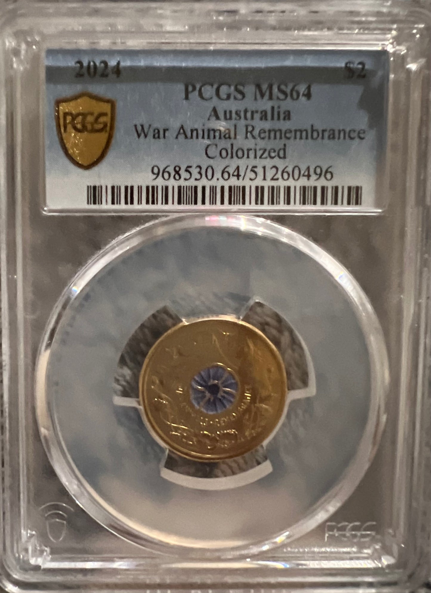 The 2024 Australian $2 War Animals Remembrance coloured coin Graded MS64 by PCGS