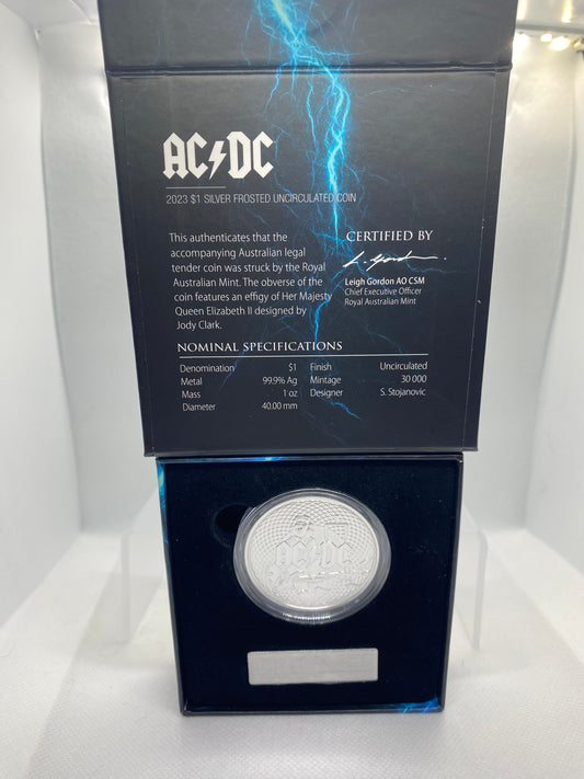 The 2023 AC/DC $1 Silver Frosted Uncirculated Coin is a tribute to the legendary Australian rock band AC/DC